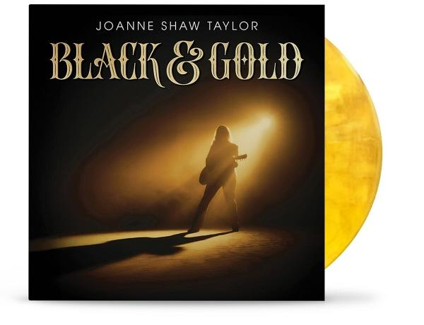 Albumcover mit Frau, die Gitarre spielt, eine goldene Schallplatte.