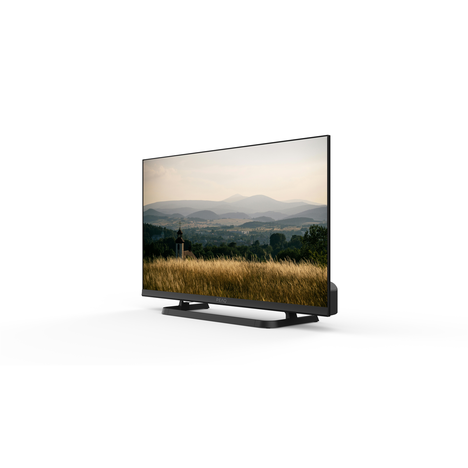 A black TV displays a landscape with fields and mountains. The TV is on a white background.
