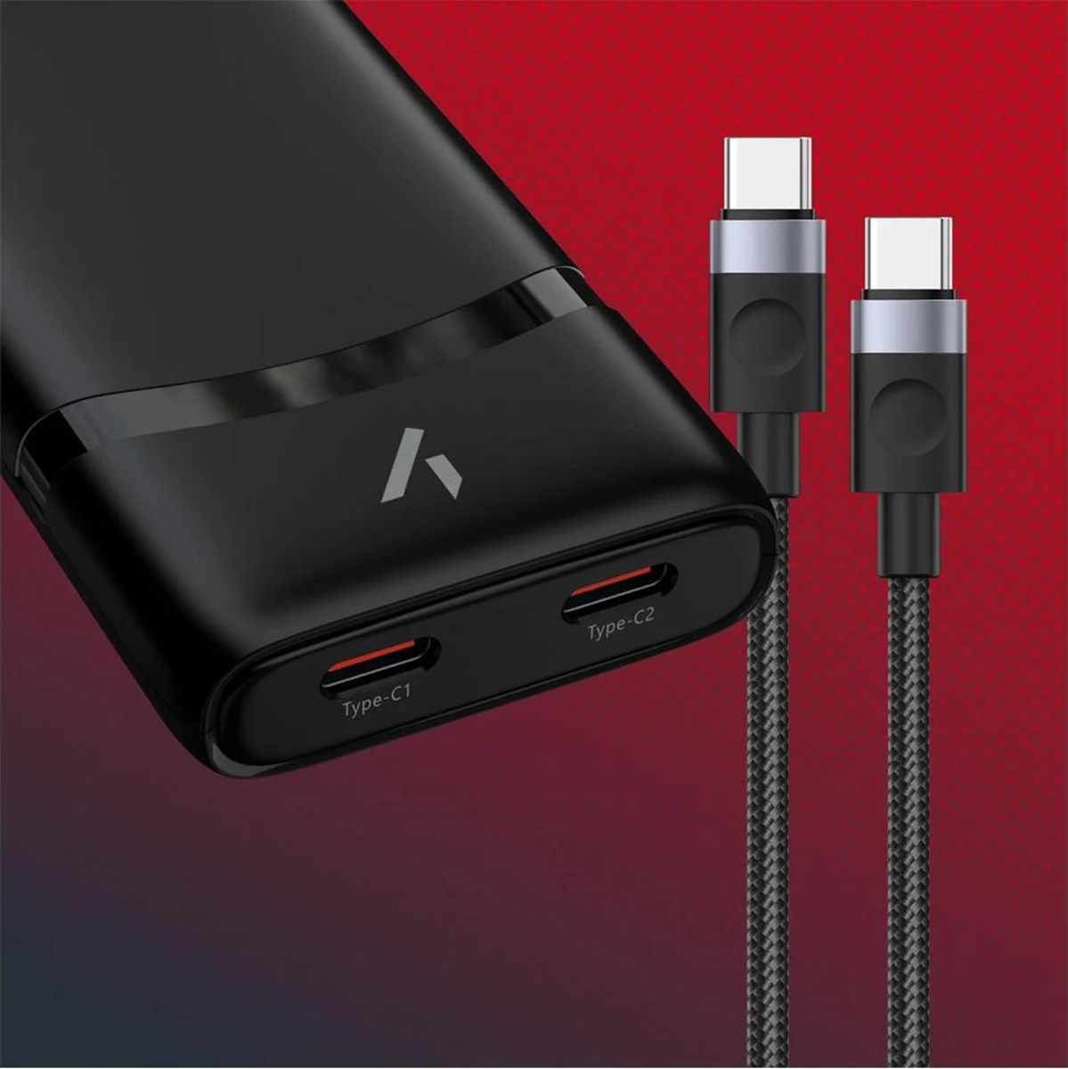 Un adaptateur secteur noir avec deux ports de charge et deux câbles de charge noirs.