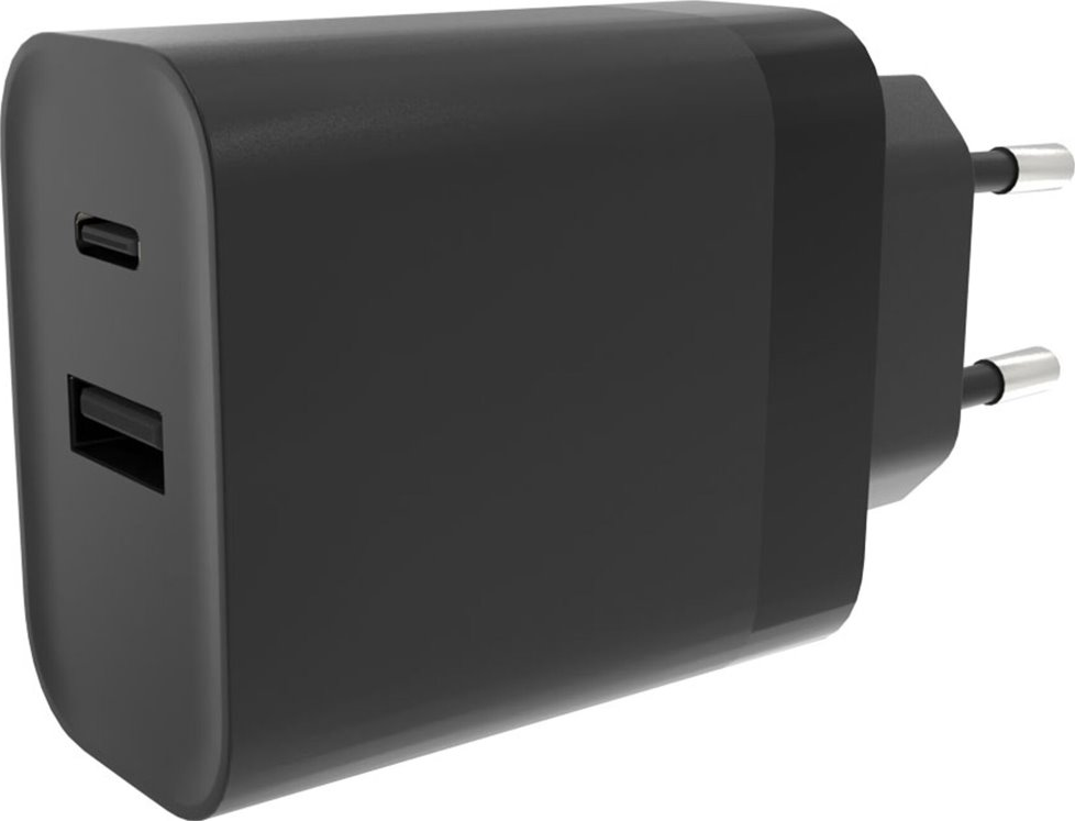 Adattatore nero con due porte USB e due spine per l'alimentazione. L'adattatore è nero.