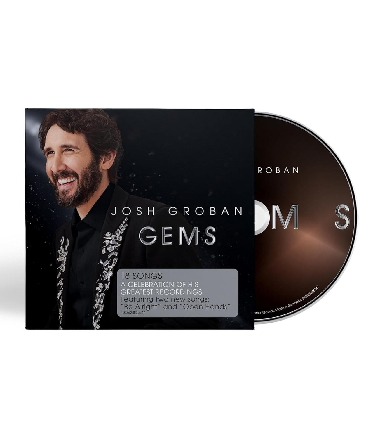 Mann in einem schwarzen Anzug, der lächelt. CD-Cover mit Text, der JOSH GROBAN GEMS sagt.