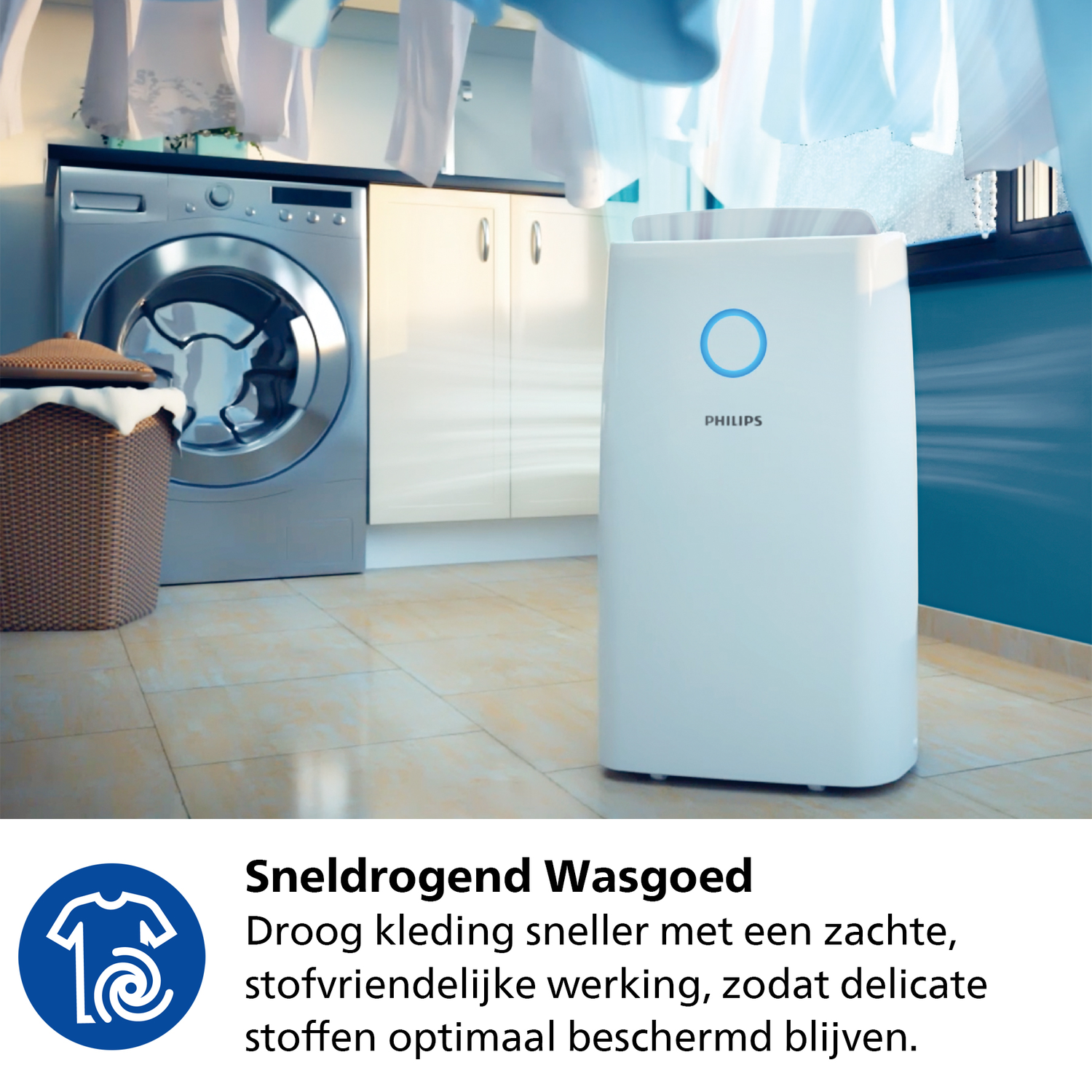White dehumidifier in a room with laundry hanging. Washing machine and cabinets in background.