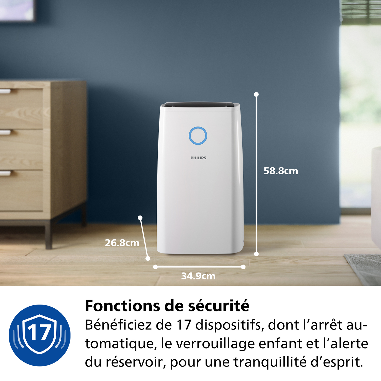 Un purificateur d'air blanc sur un sol en bois. Des dimensions sont données. Le texte en français décrit les caractéristiques de sécurité.