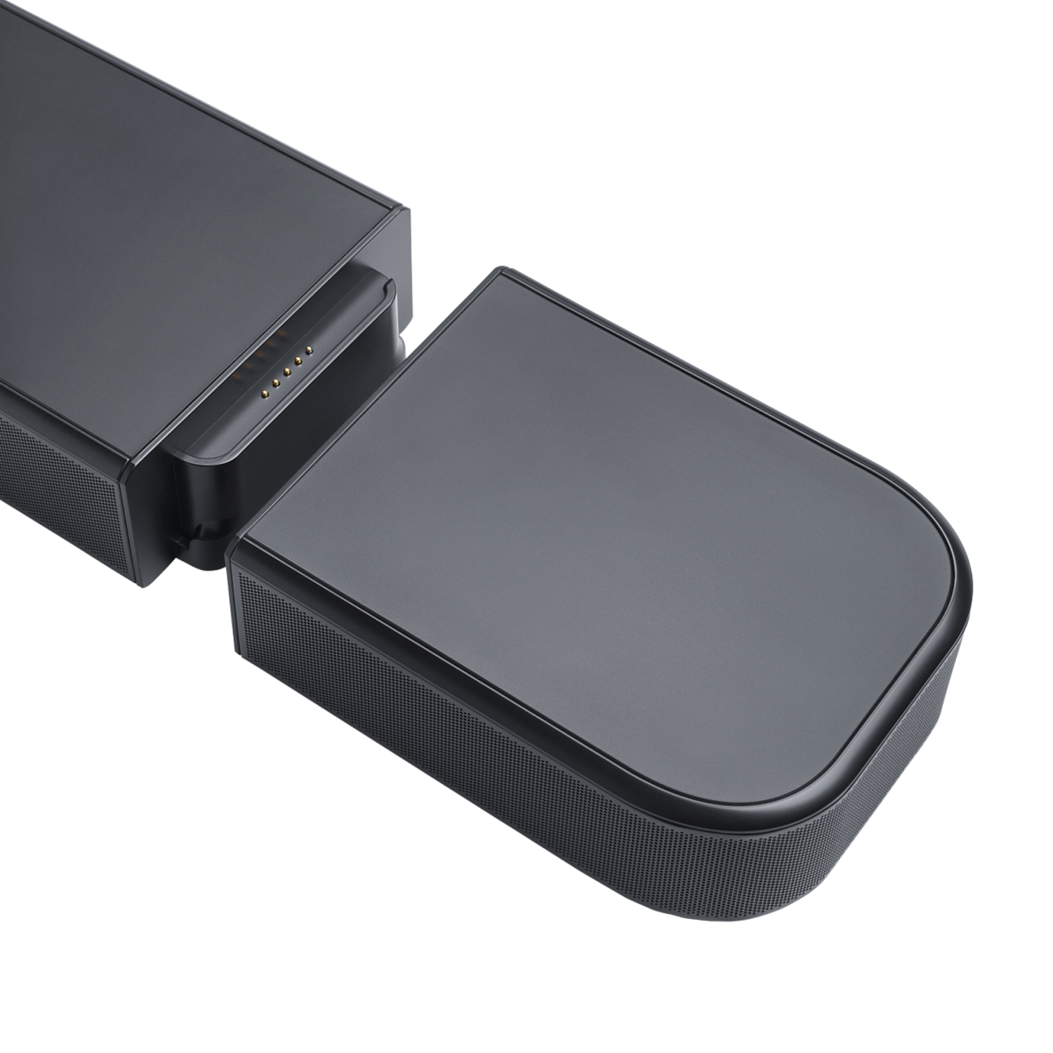 Gros plan d'un haut-parleur détaché, connecté à une barre de son, contacts de charge.