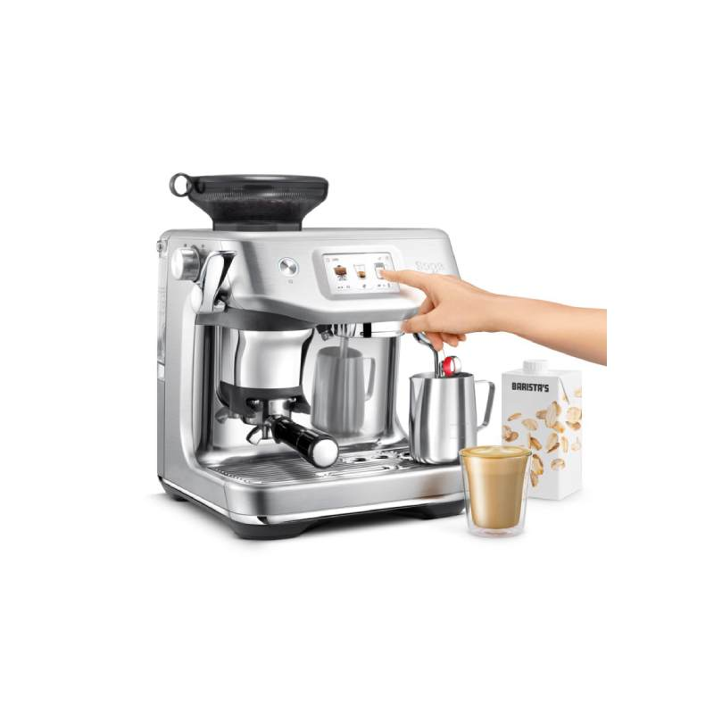 Silver espresso machine with a person's hand on the screen.