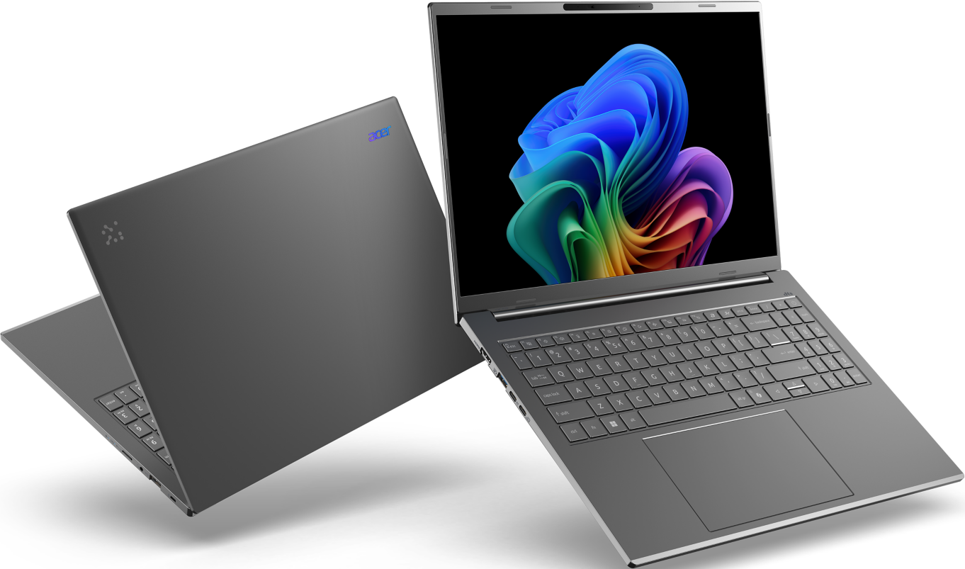 Zwei Laptops, einer offen, bunte Bildschirme, grau.