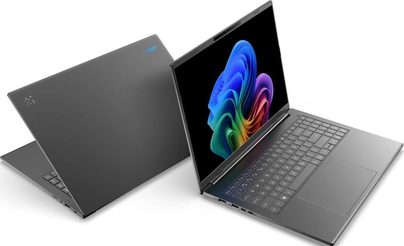 Zwei Laptops, einer offen, farbenfrohes Display, grau.