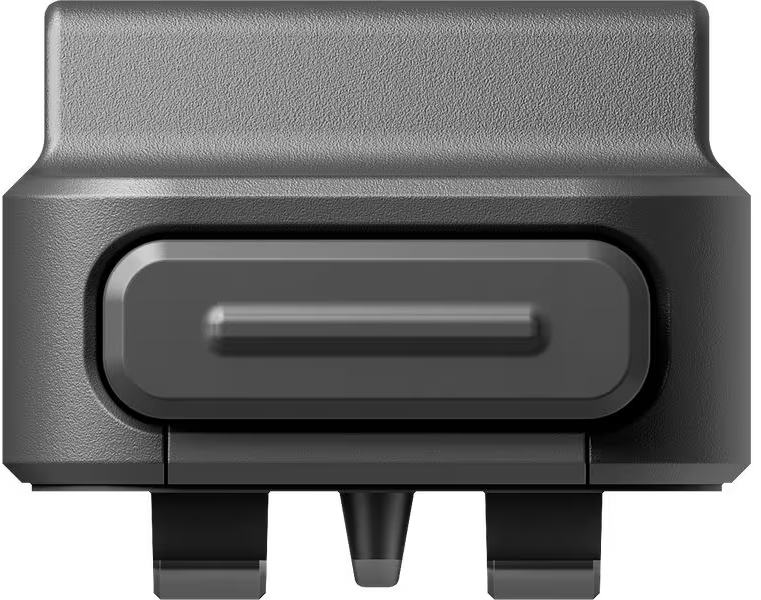 Appareil noir avec un bouton et deux broches. Le dessus est texturé.