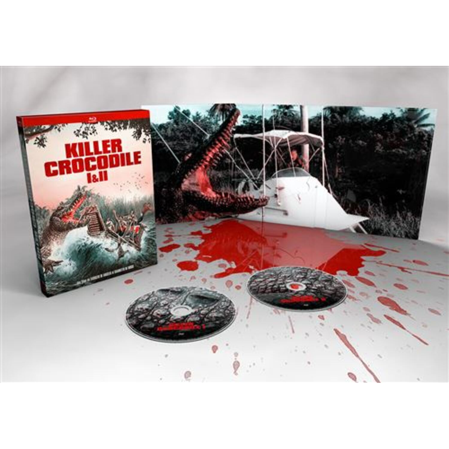 Boîtier DVD avec 'Killer Crocodile I&II'. Montre crocodile attaquant un bateau, deux disques et un fond éclaboussé de sang.