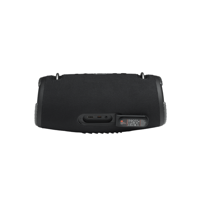 Parte trasera de un altavoz JBL negro con puertos y etiquetas.