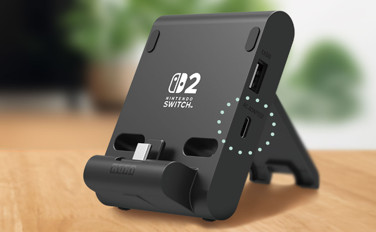 Nintendo Switch logosu ve bağlantı noktaları olan siyah cihaz.