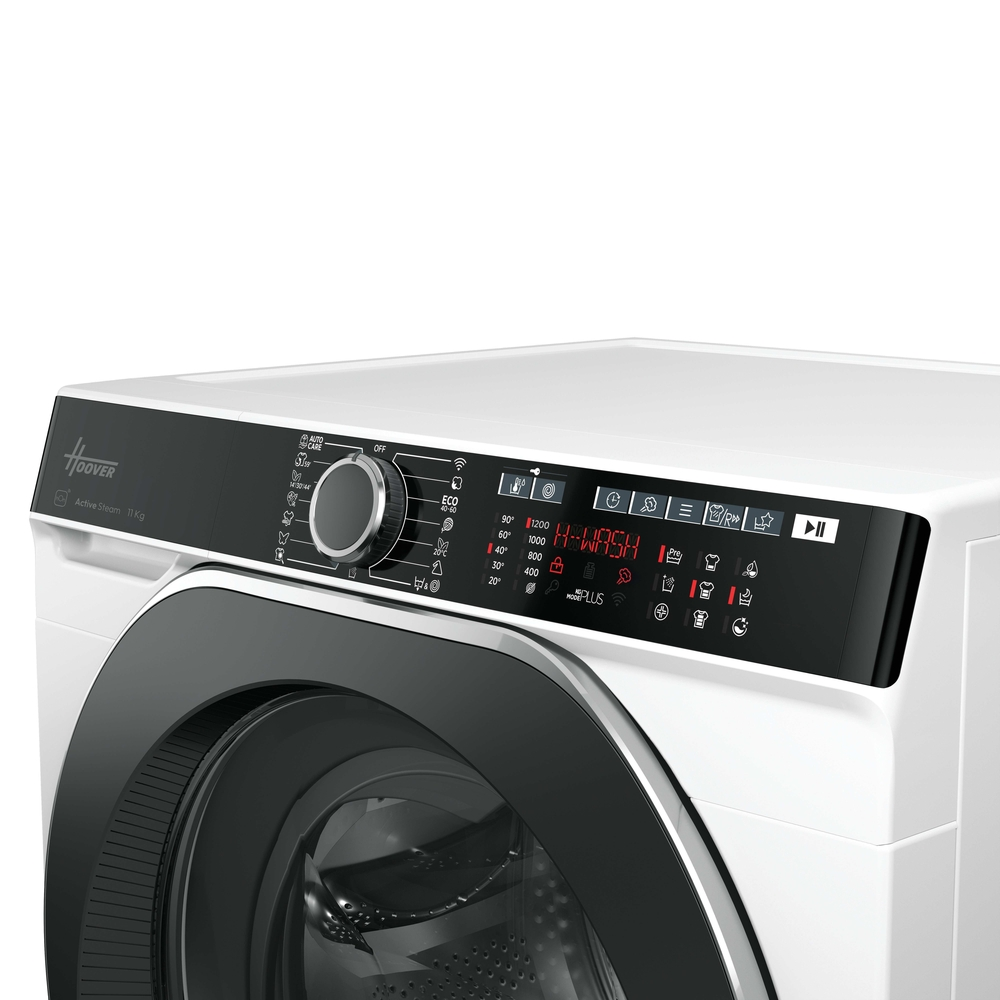 Beyaz Hoover çamaşır makinesi kontrol paneli. Kadran, ekran ve çeşitli düğmeler içerir.
