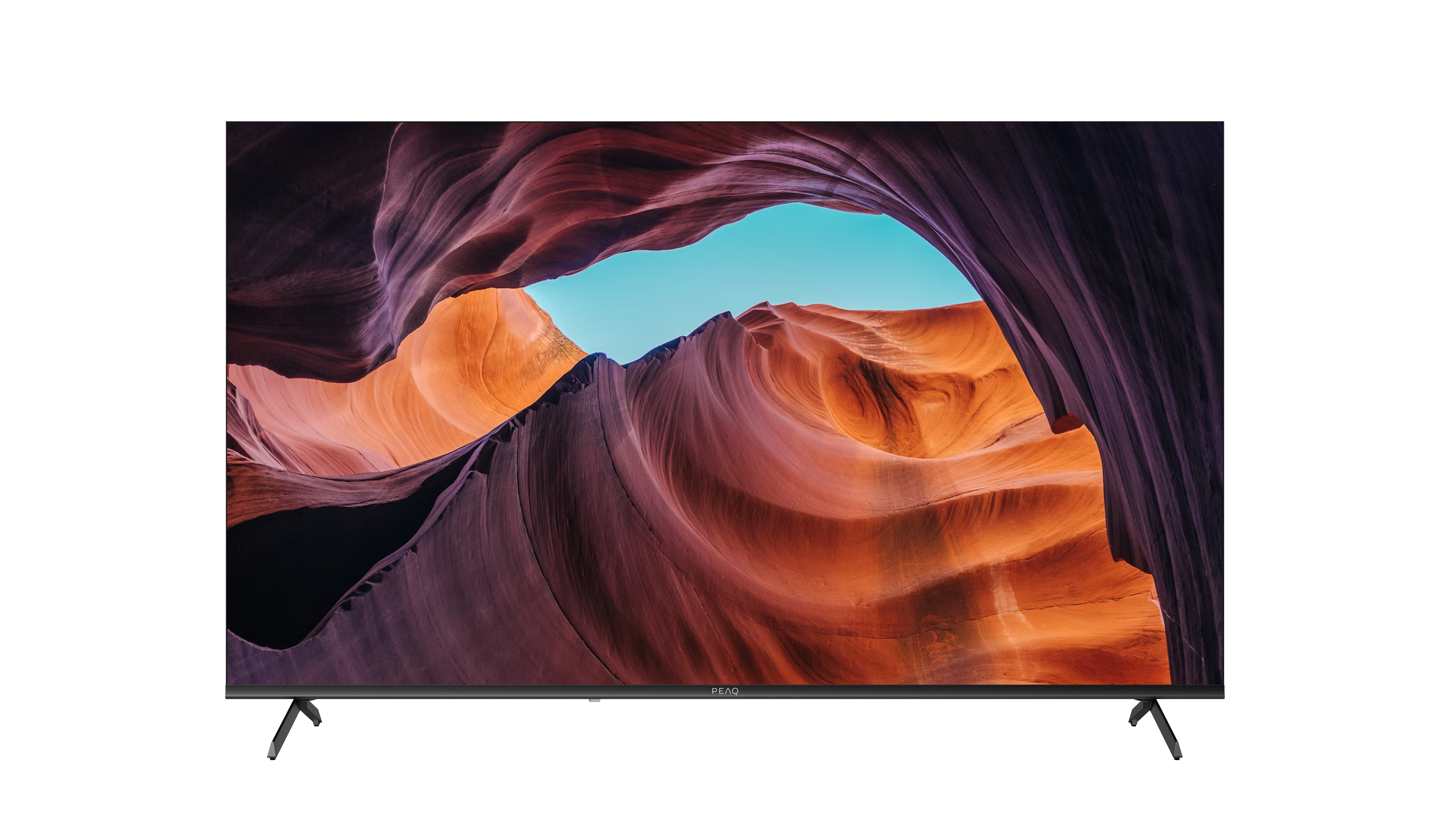 Telewizor wyświetla scenę kanionu z czerwonymi, pomarańczowymi i fioletowymi formacjami skalnymi i błękitnym niebem. Telewizor ma cienkie nogi.
