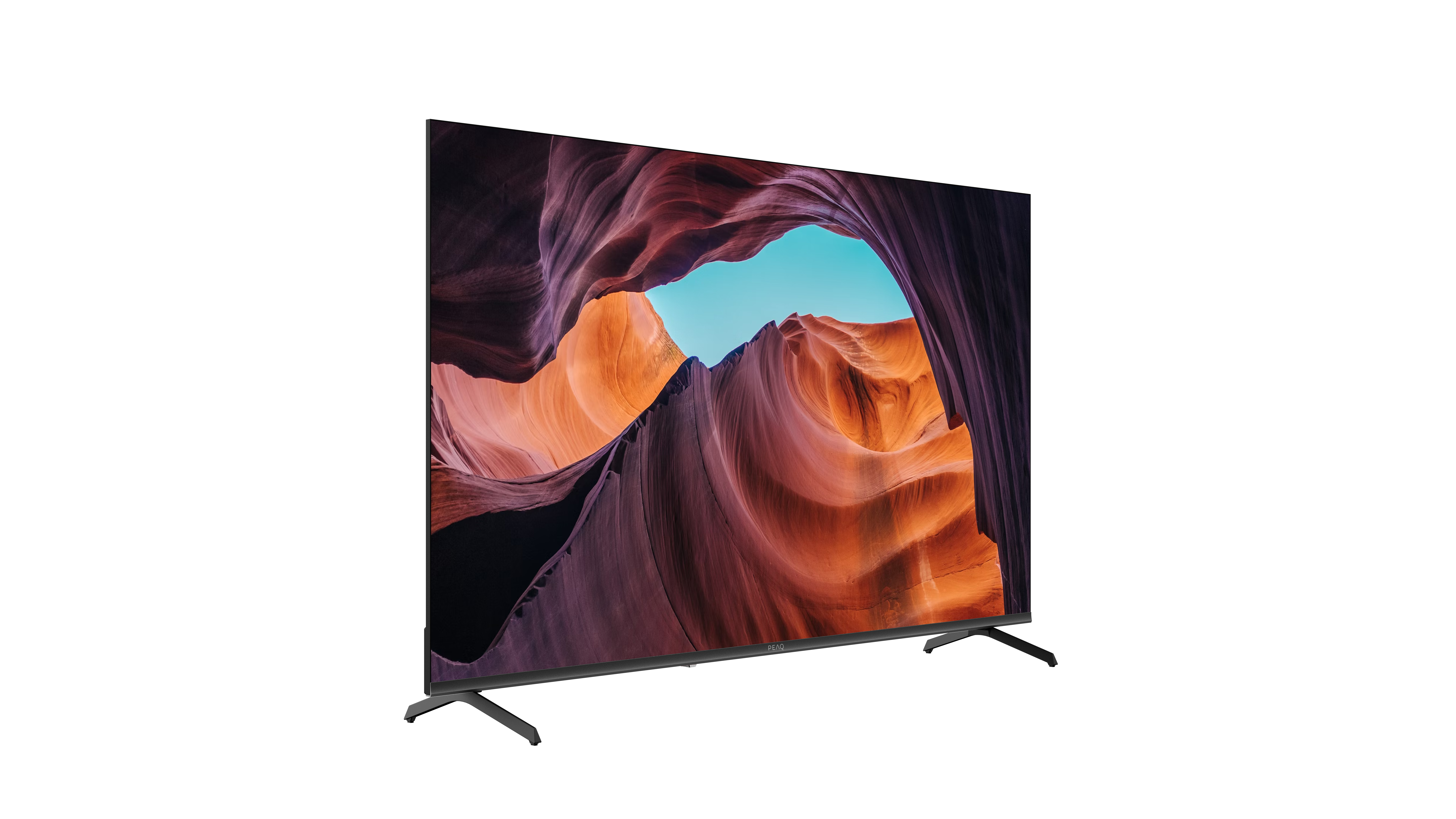 Telewizor z płaskim ekranem wyświetla scenę kanionu z pomarańczowymi i fioletowymi formacjami skalnymi i niebieskim niebem. Telewizor ma czarne nogi.