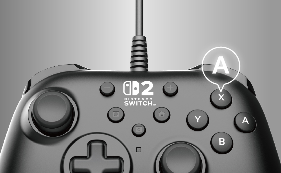 'A' düğmesi vurgulanmış Nintendo Switch kontrolcüsü. Arka plan gri.