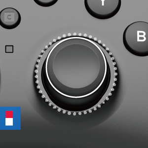 Nintendo Switch kontrolcüsünün başparmak çubuğunun yakın çekimi. Arka plan gri.