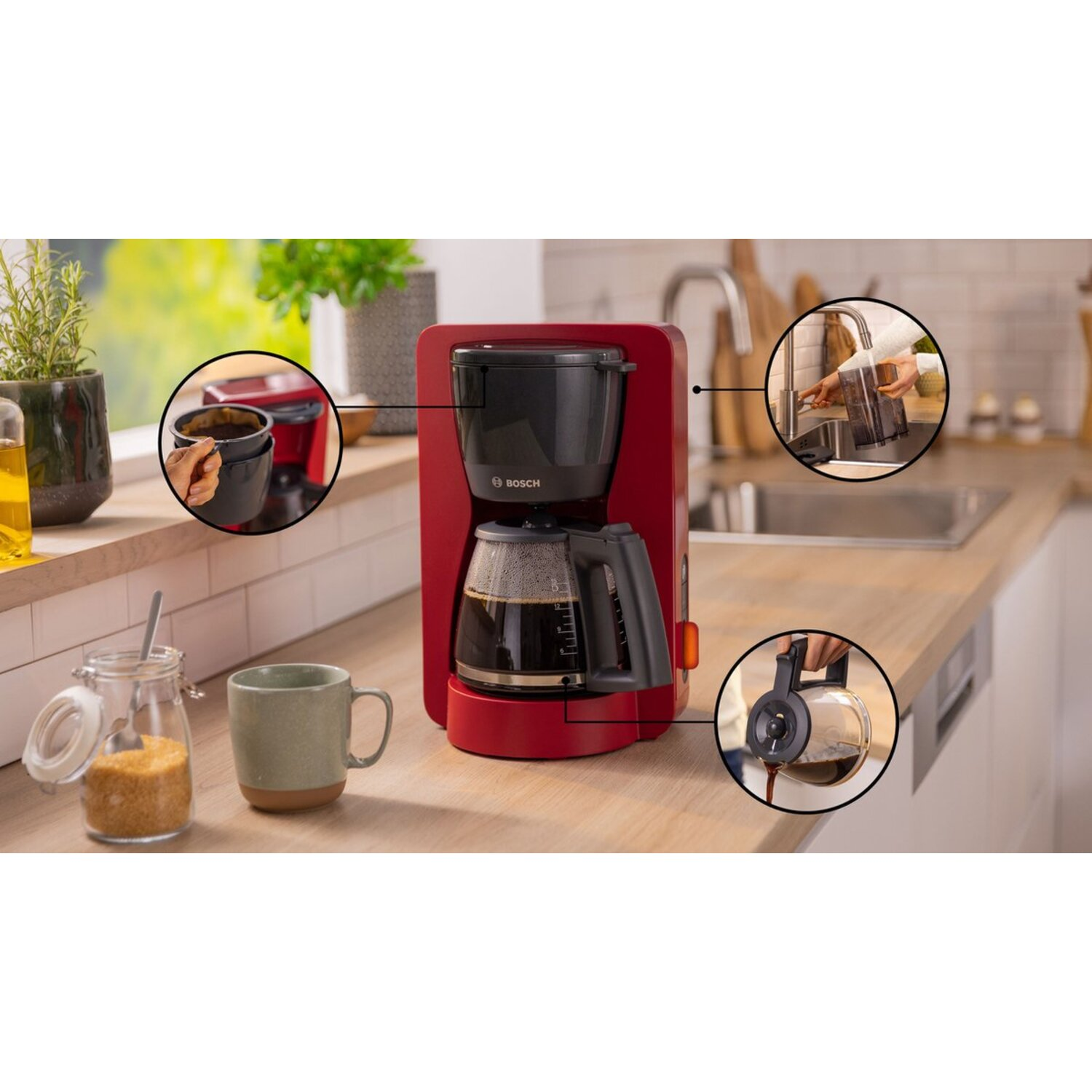 Red coffee maker with detailed inserts showing coffee preparation steps. Kitchen setting with items.