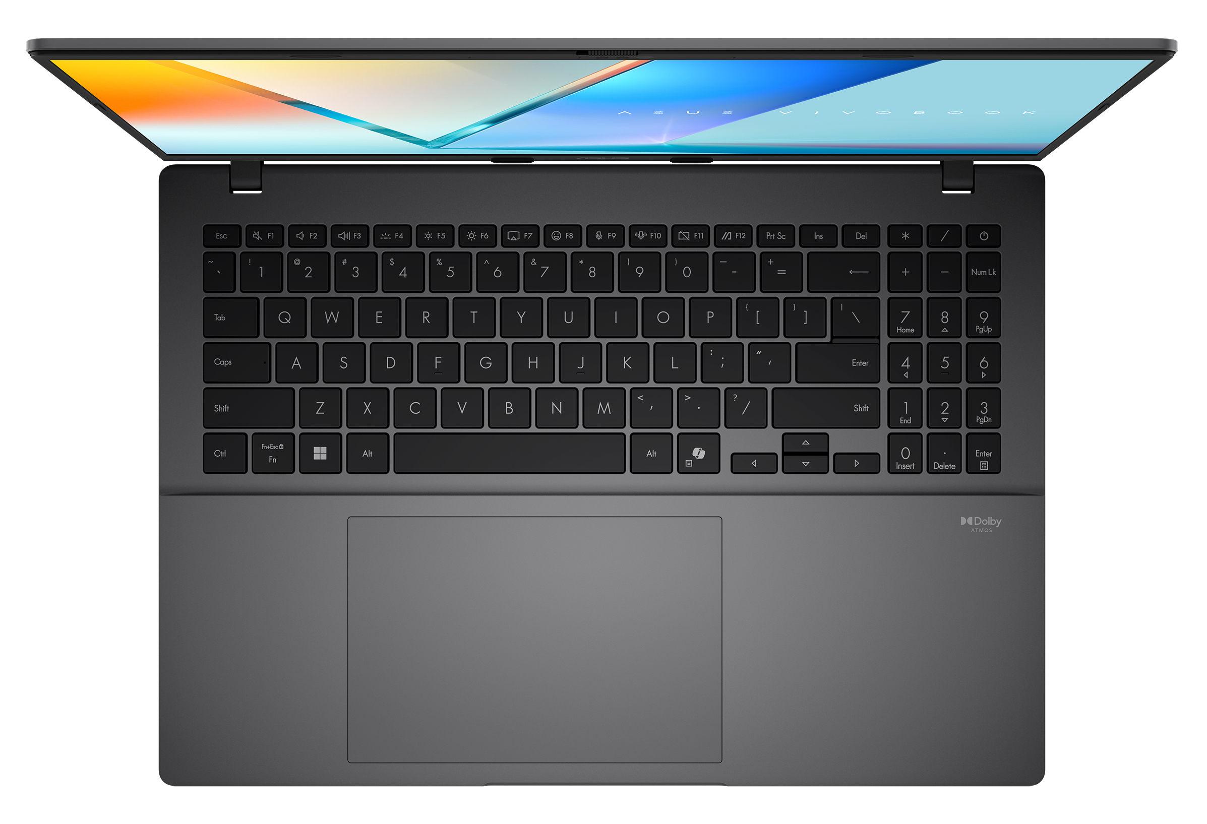 Szary laptop, widok z góry, widoczna klawiatura. Ekran wyświetla design. Ciemne tło.