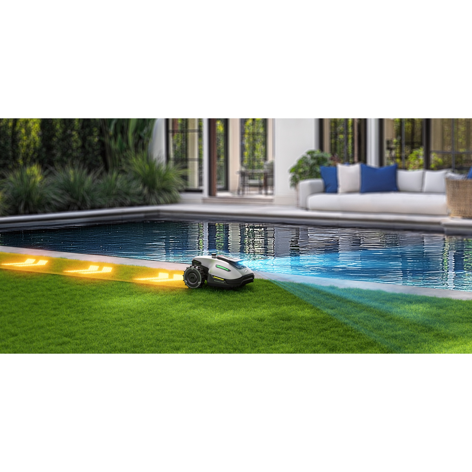 Tagliaerba robotico sull'erba vicino a una piscina, con una casa sullo sfondo.