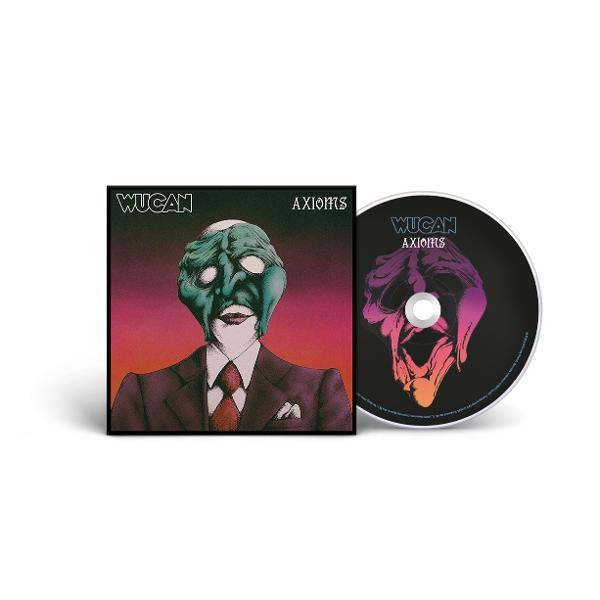 Albumcover: grüngesichtige Figur im Anzug. CD: gleiches Bild auf schwarzem Hintergrund.
