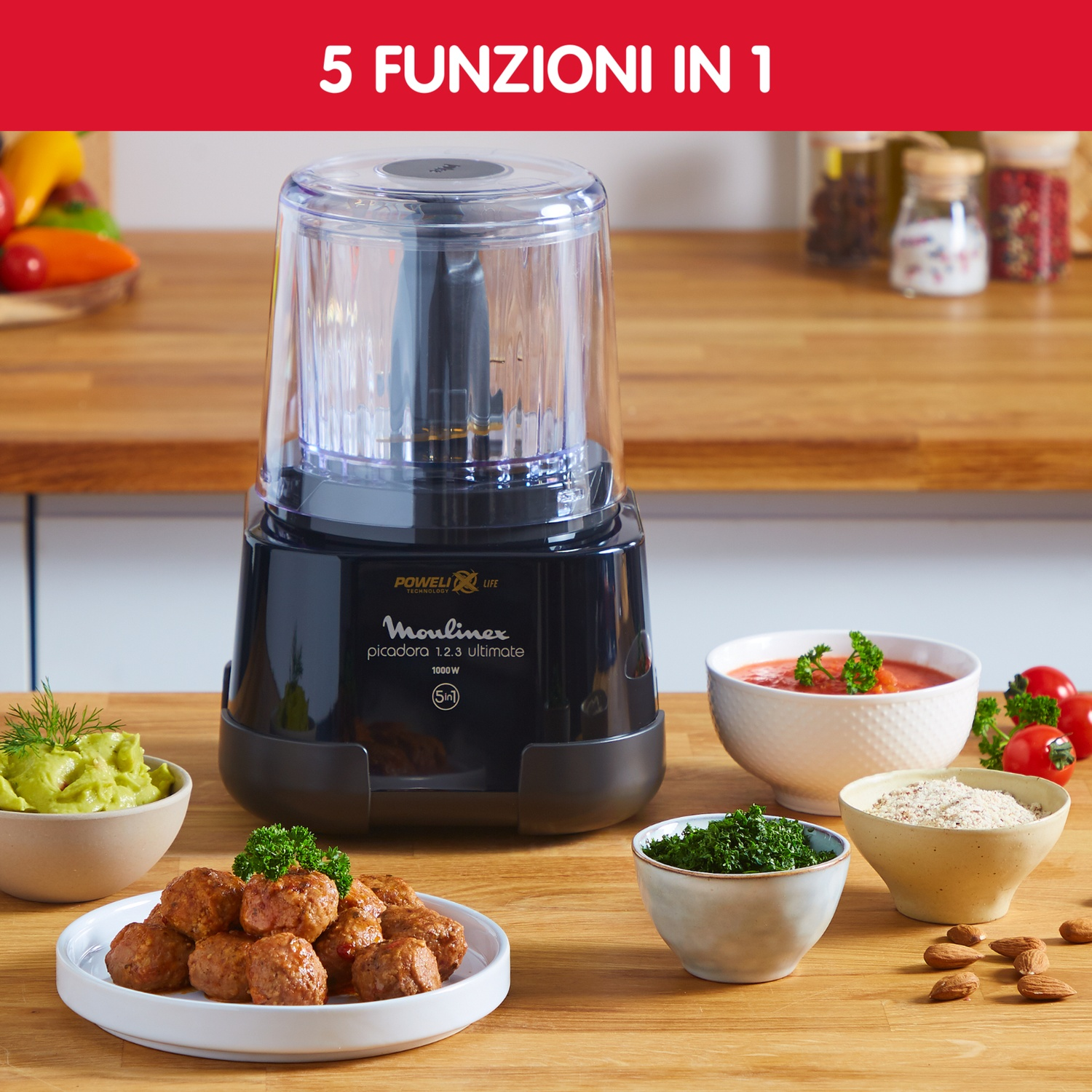 Robot da cucina nero con più ciotole. Include guacamole, polpette e altri ingredienti.