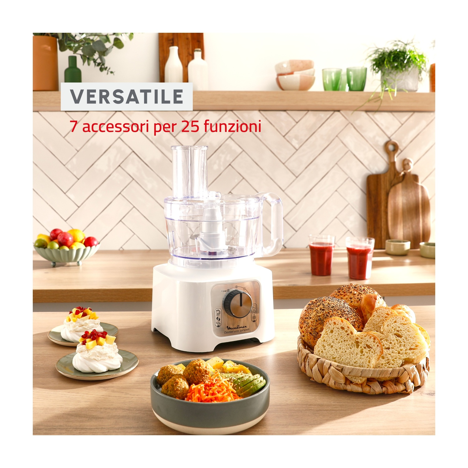 Robot da cucina Moulinex bianco con cibo, frutta e pane.