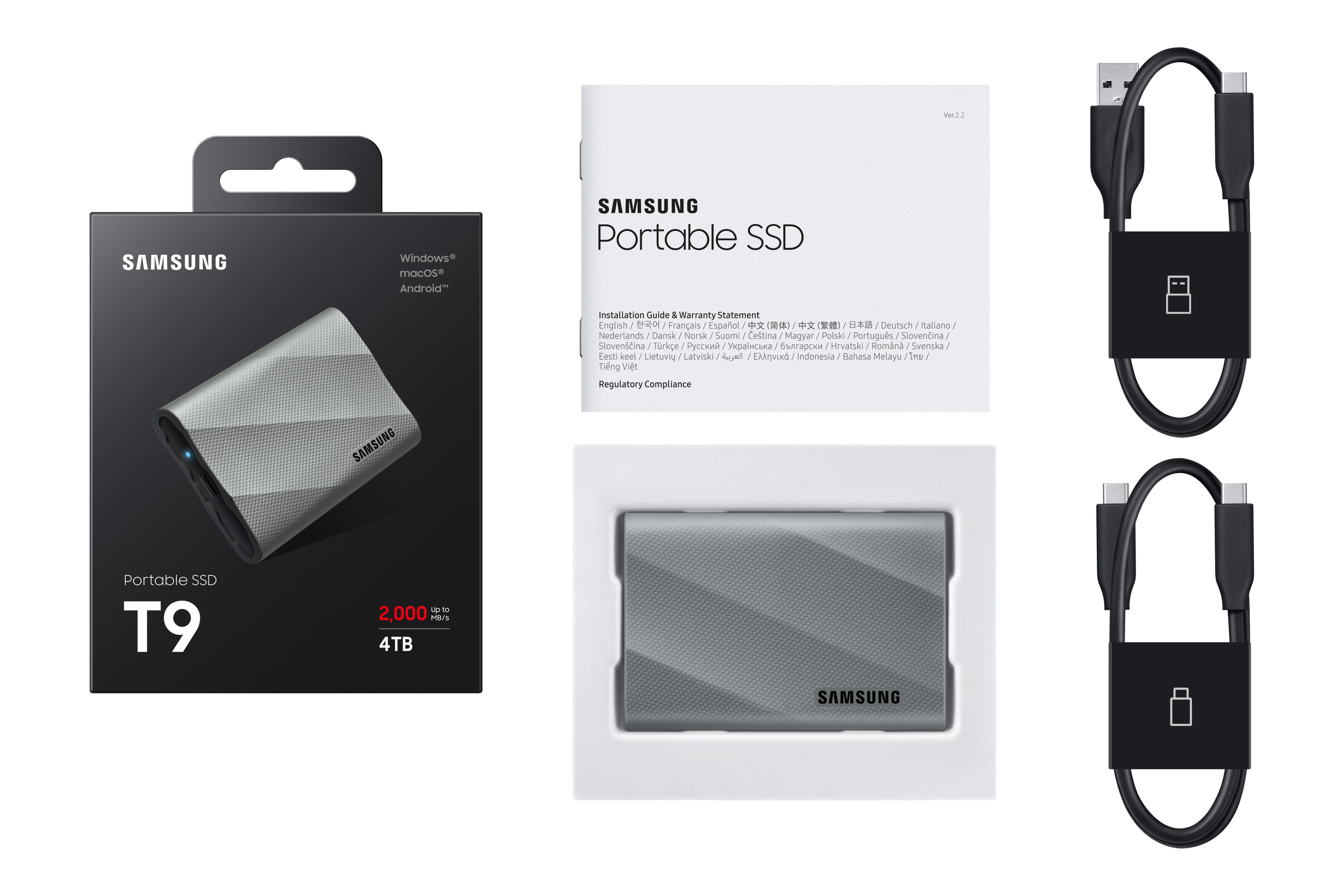Samsung T9 Portable SSD, Verpackung, Anleitung, Kabel. SSD silber, schwarze Kabel, weiße Anleitung. Schwarzer Hintergrund.