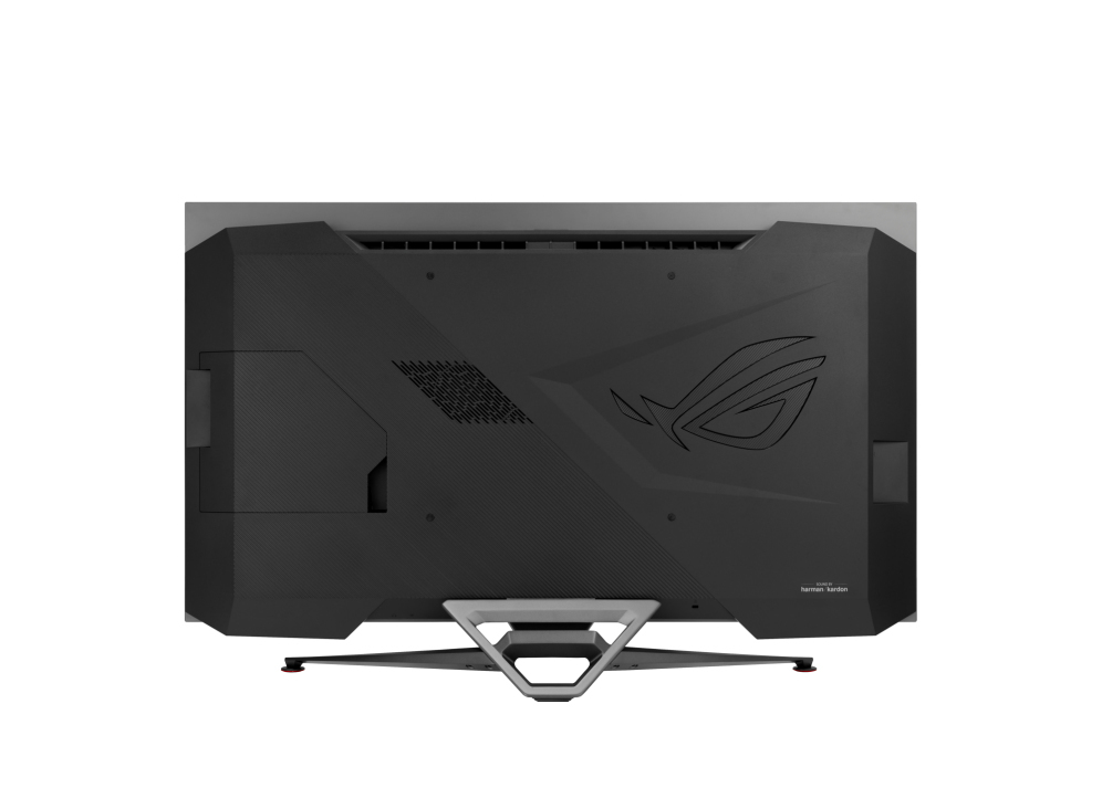 Parte trasera de un monitor de computadora negro. Tiene el logotipo de Republic of Gamers, la marca Harman Kardon y un soporte único.