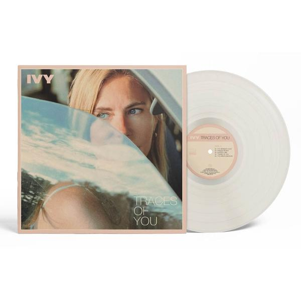 Albumcover. Gesicht einer Frau spiegelt sich im Spiegel. Albumtitel: Traces of You. Vinyl-Schallplatte sichtbar.