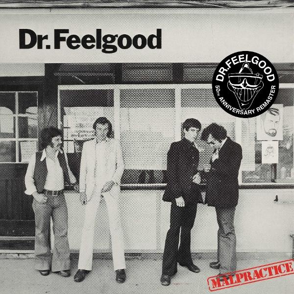 Albumcover von Dr. Feelgood: Vier Männer in Anzügen stehen vor einem Laden.