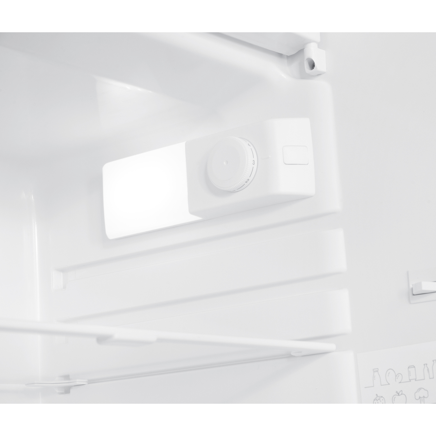 Inside of a white refrigerator with a light and controls.