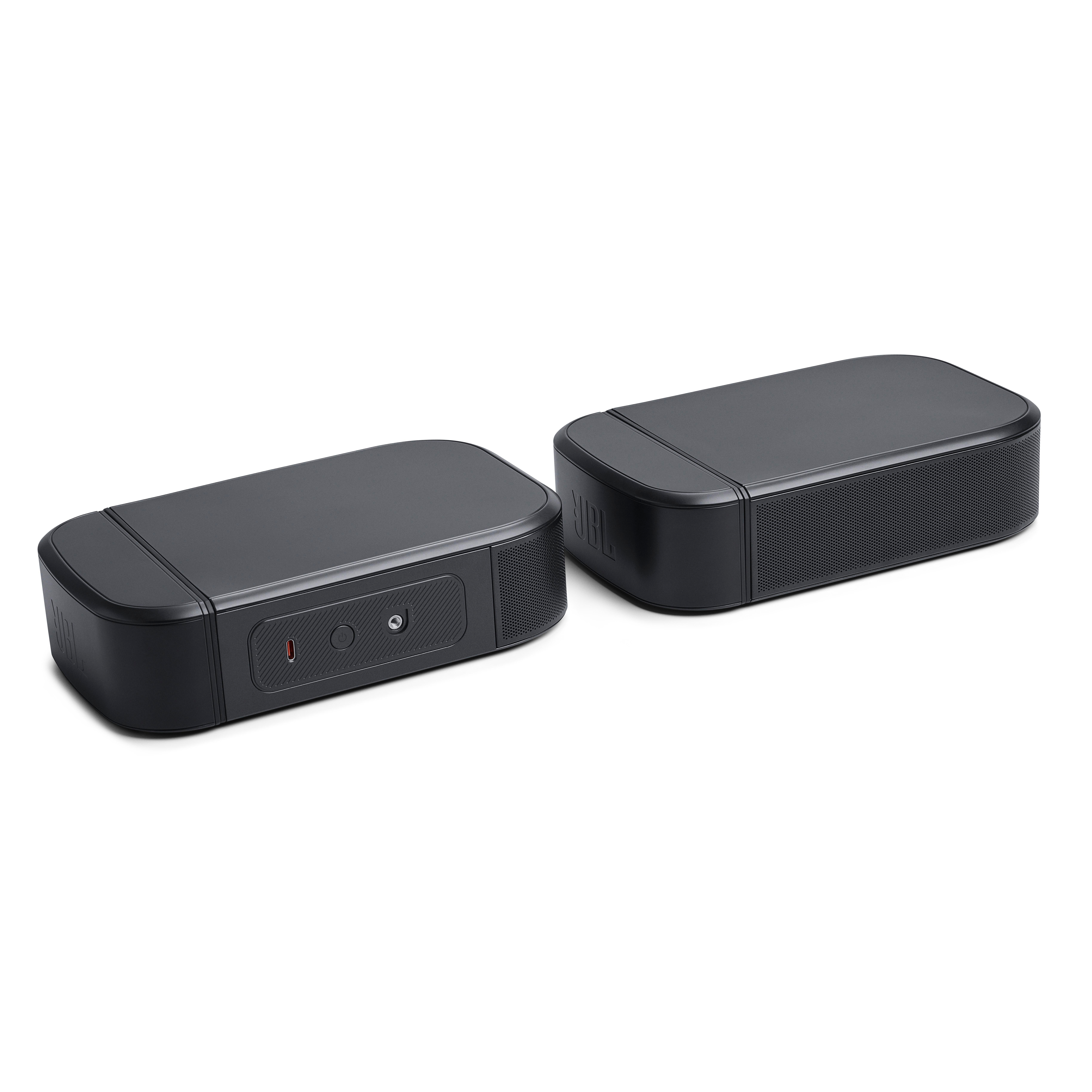 Zwei schwarze JBL-Lautsprecher nebeneinander. Sie haben eine rechteckige Form.