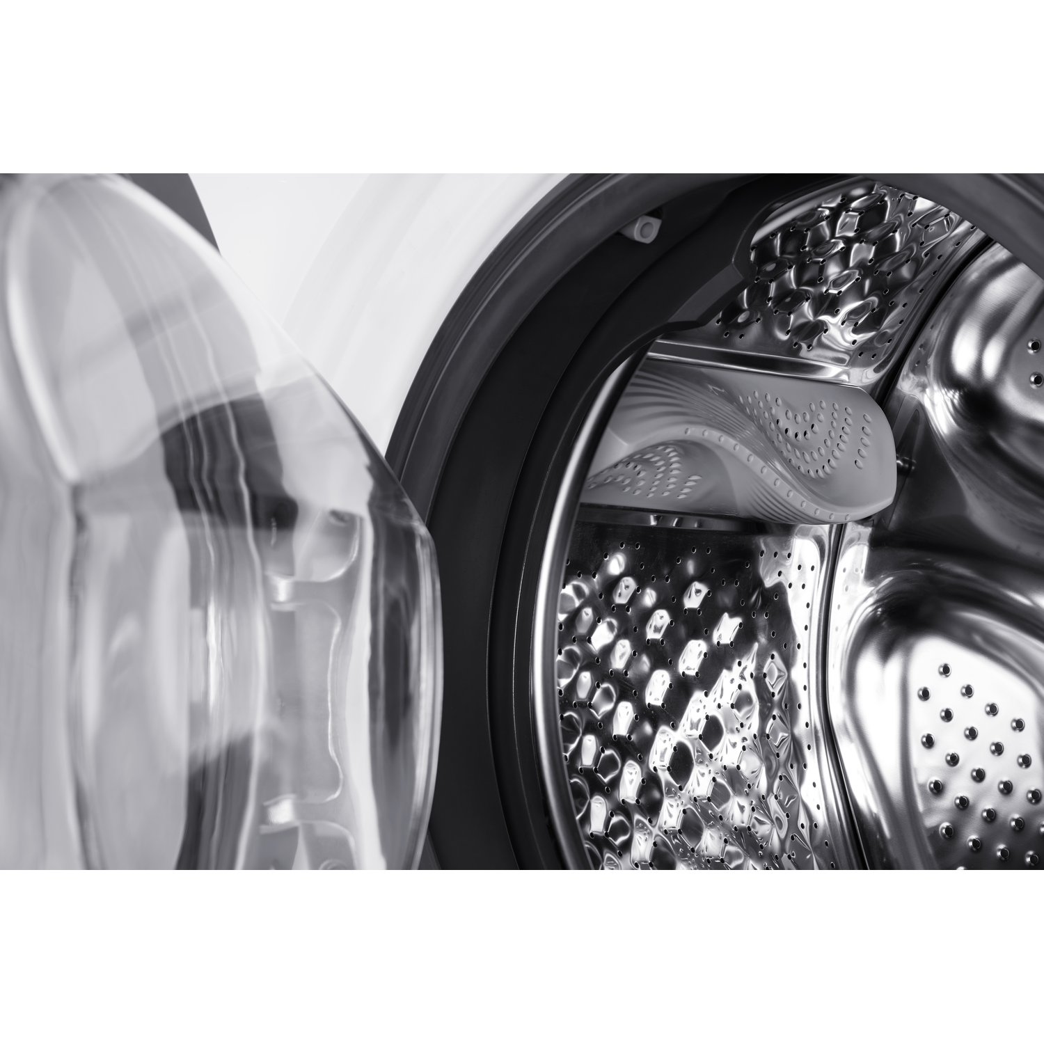 Close-up of the washing machine drum interior, showing the drum and door seal.