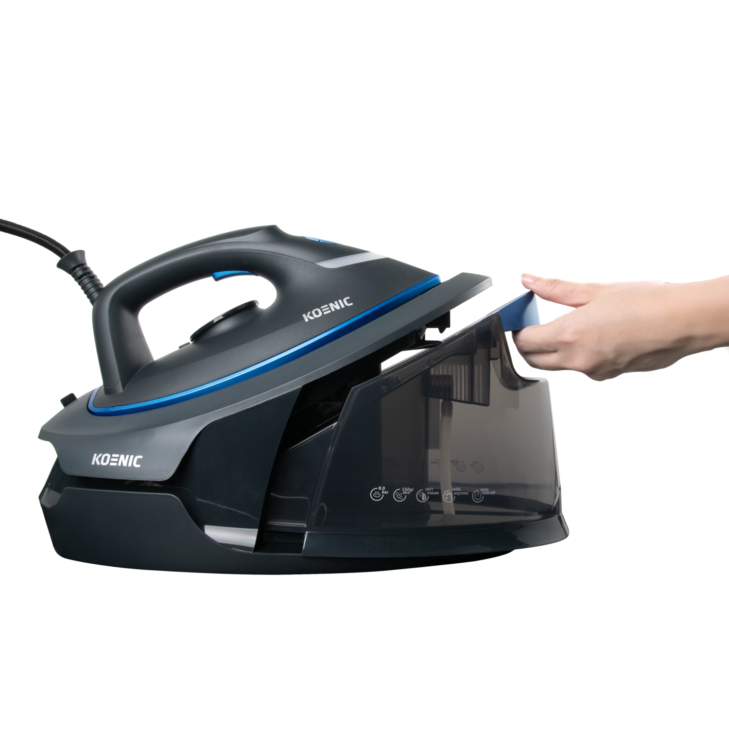 Filling water tank of a Koenic steam iron, showing the water level, black background.