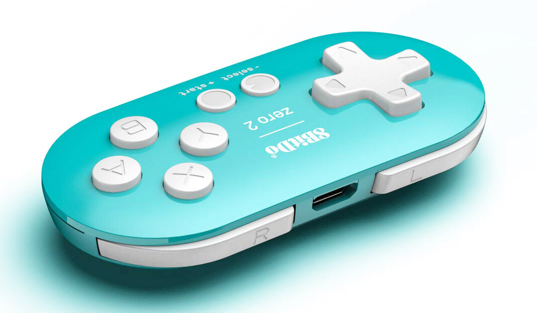 Turkusowy kontroler z białymi przyciskami. Posiada d-pad, przyciski X, Y, A i B oraz przyciski select i start.