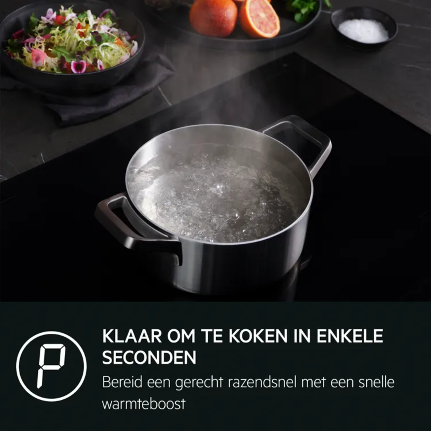 A pot of boiling water sits on a black cooktop. Steam rises.