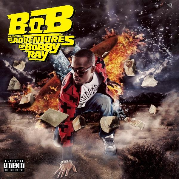 Album borító: B.o.B térdel tűz és törmelék közepette. A művész szemüveget visel.