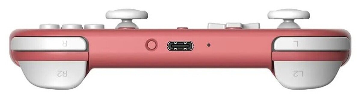 Różowo-biały kontroler do gier. Posiada przyciski, triggery i joysticki. Zawiera port ładowania i gniazdo audio.