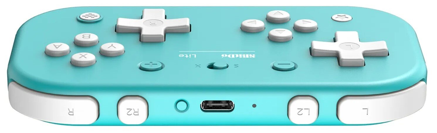 Turkusowy kontroler do gier. Przyciski: L, R, X, Y, A, B, L2, R2, pad kierunkowy, start/select i port USB.