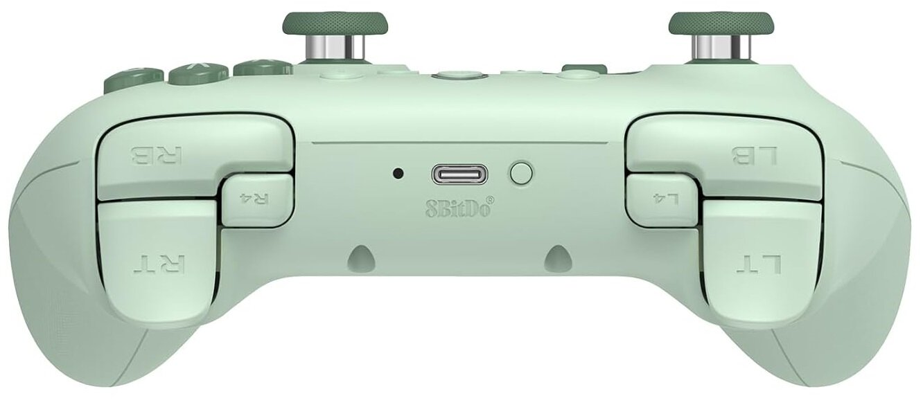 Miętowy kontroler 8BitDo. Widoczne przyciski, spusty i joysticki.