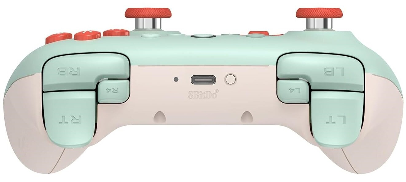 Miętowy kontroler z koralowymi przyciskami. Widok z tyłu z spustami i portami. Białe tło.