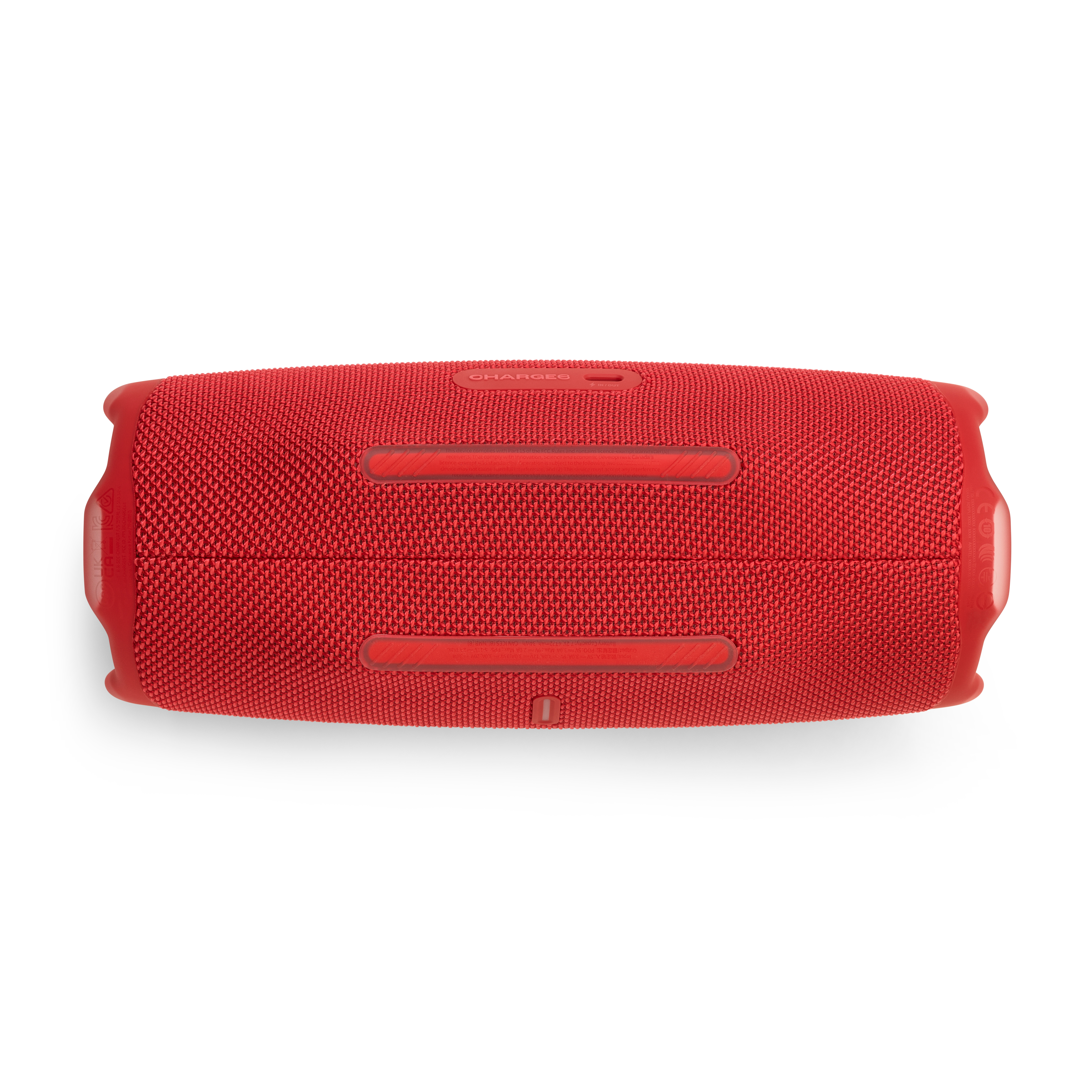 Enceinte JBL rouge, vue de dessous, sur fond blanc. Avec port de charge et texte Charge 6.