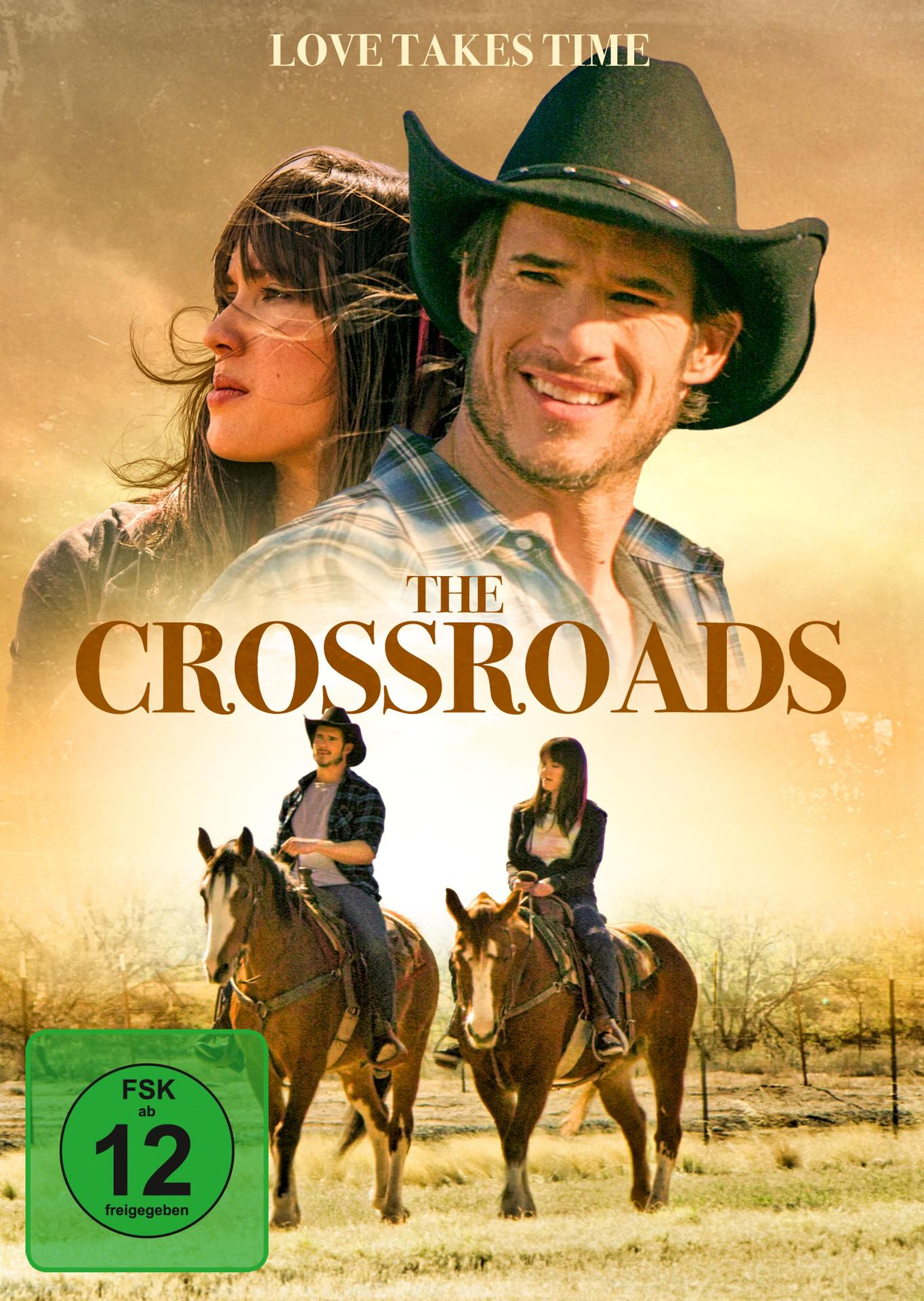 Film-Cover, ein Mann und eine Frau auf Pferden, Text 'The Crossroads'. Hintergrund hat zwei weitere Reiter auf Pferden.