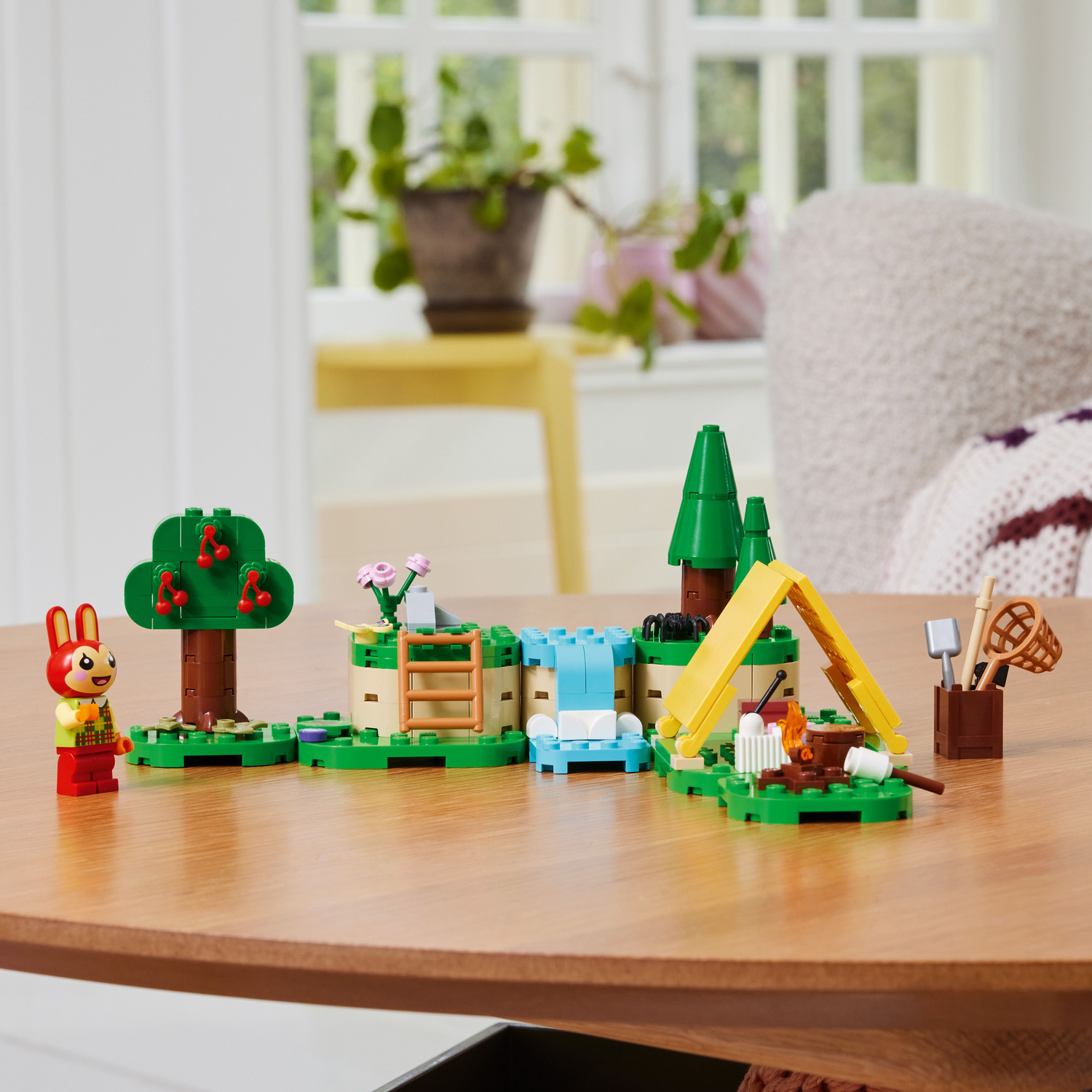 LEGO Animal Crossing set: Camping scene with a bunny, tent, and a waterfall.