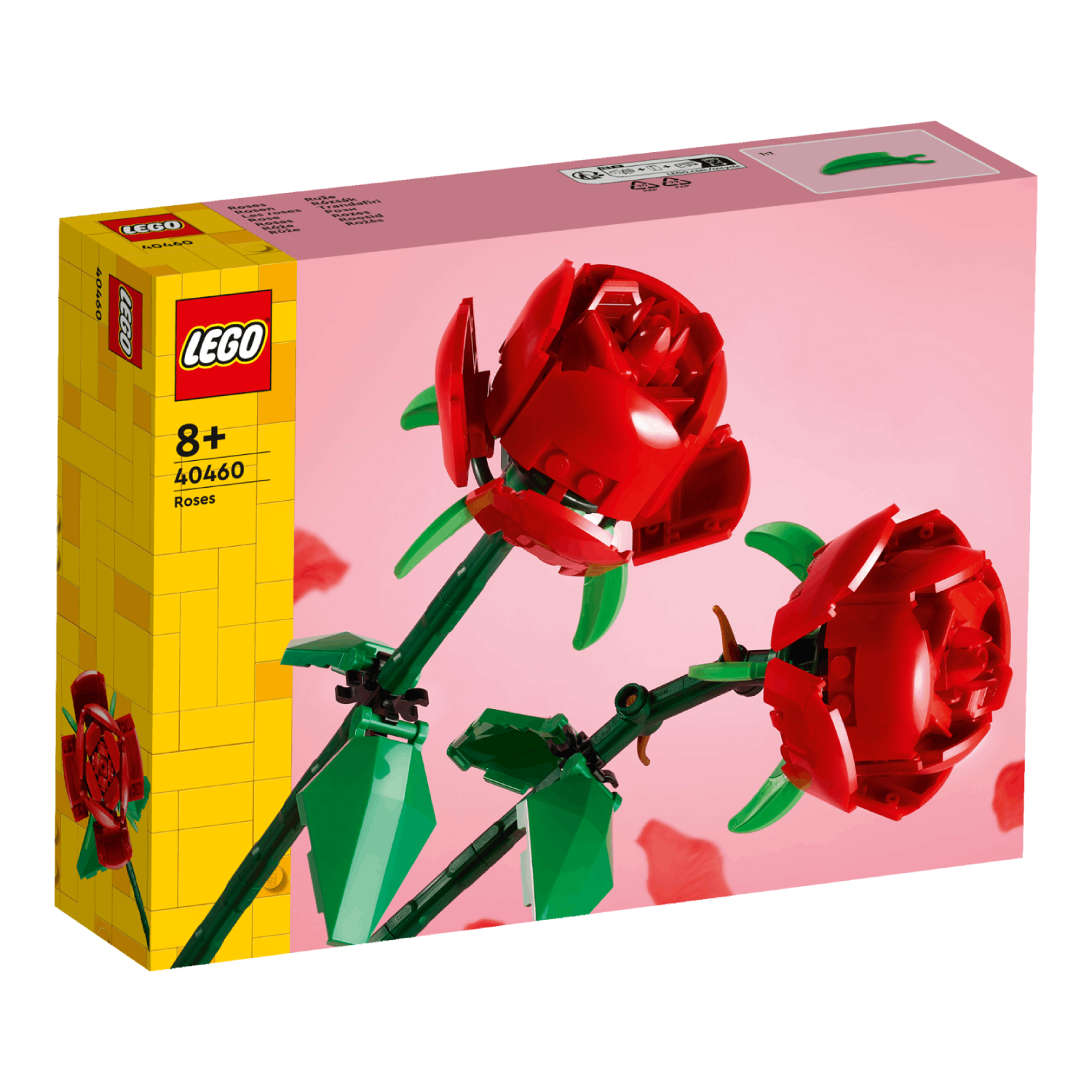 Lego box with Lego roses. The roses have red petals, green stems and leaves. Pink background.
