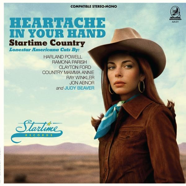 Albumcover: Frau mit Cowboyhut, blauem Schal, brauner Jacke. Text: Heartache In Your Hand.