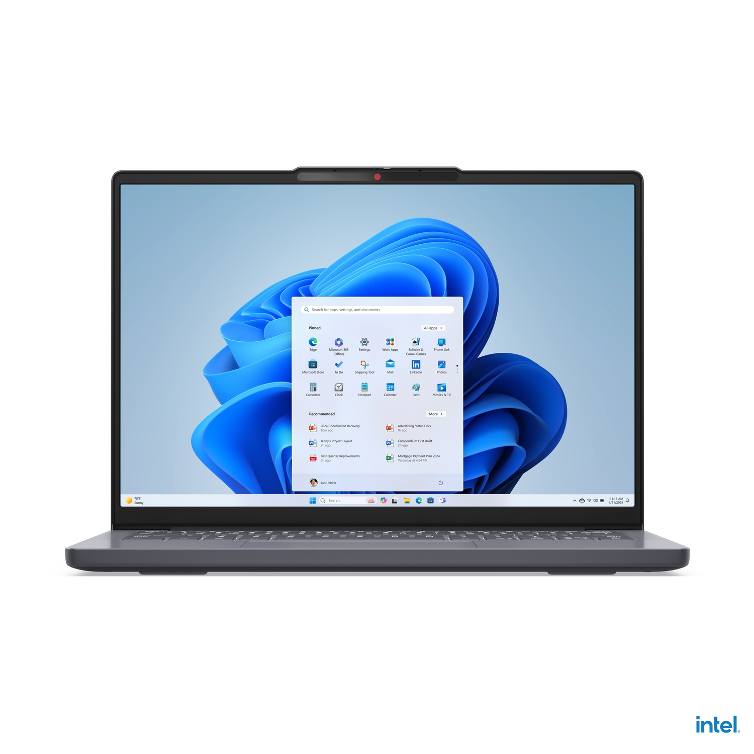 Gray laptop, open, with Windows 11 screen, showing apps and settings.
