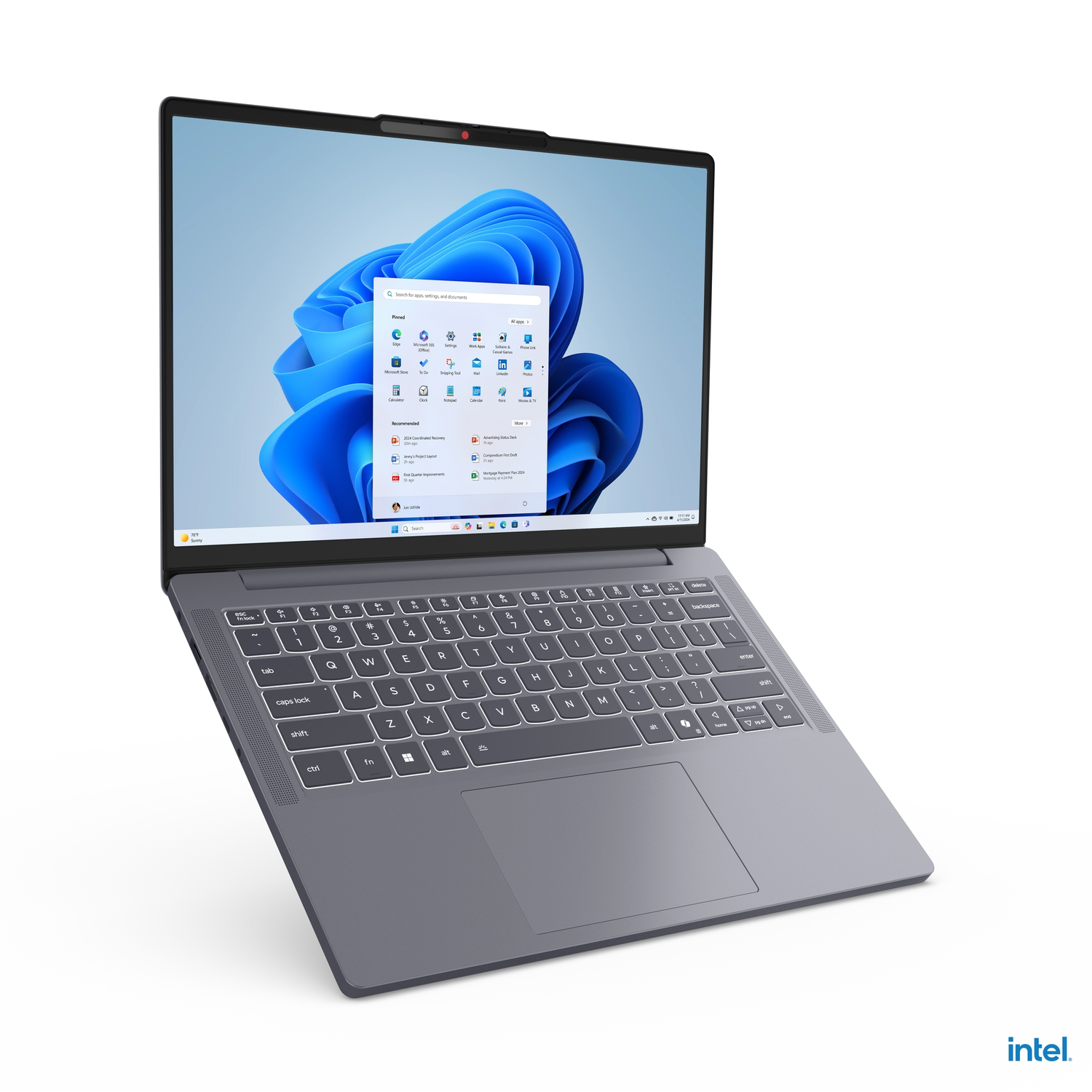 Gray laptop, open, with Windows 11 screen, tilted upwards, keyboard visible.
