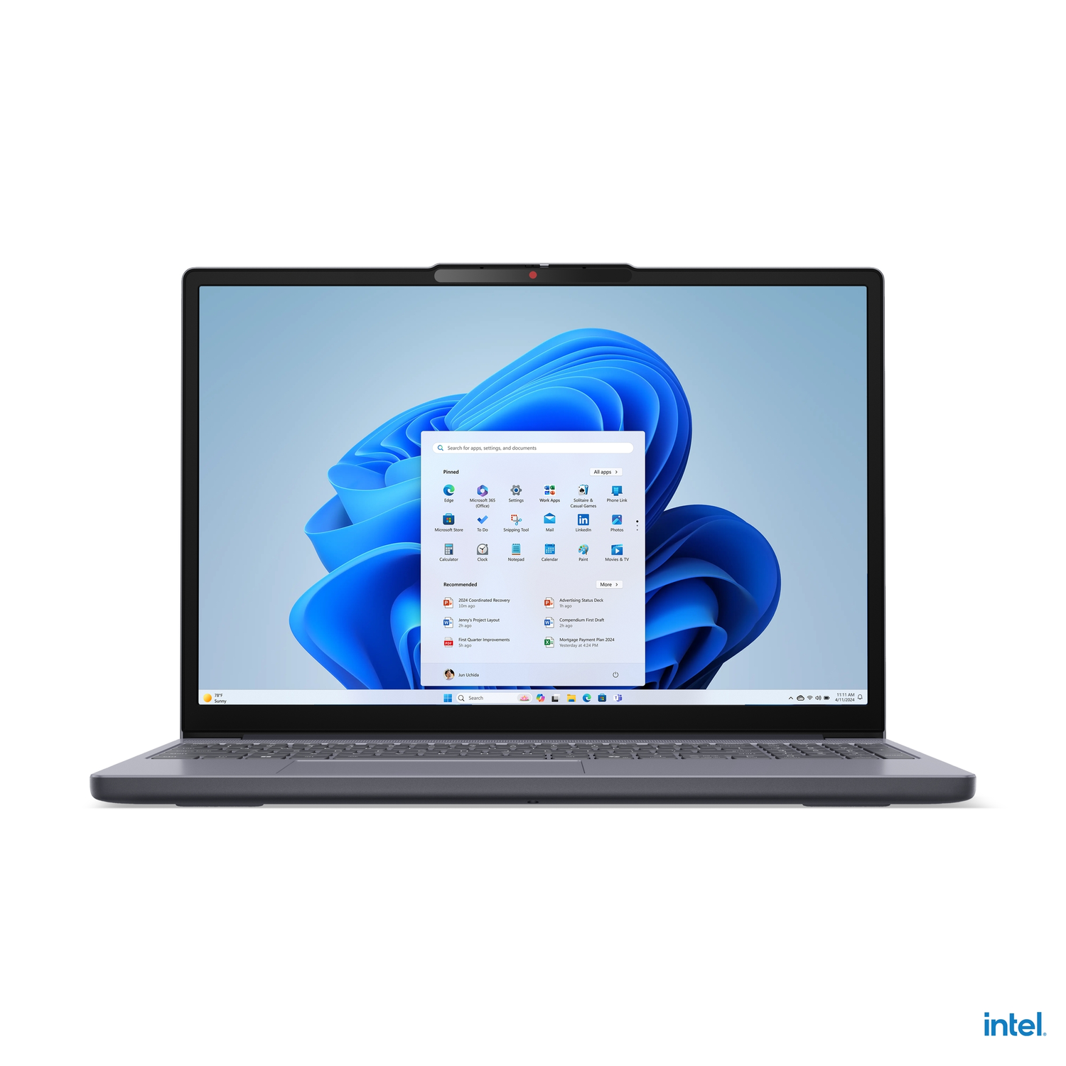 Gray laptop on white, front view. Screen displays Windows 11 interface, with a web camera. The laptop is open.