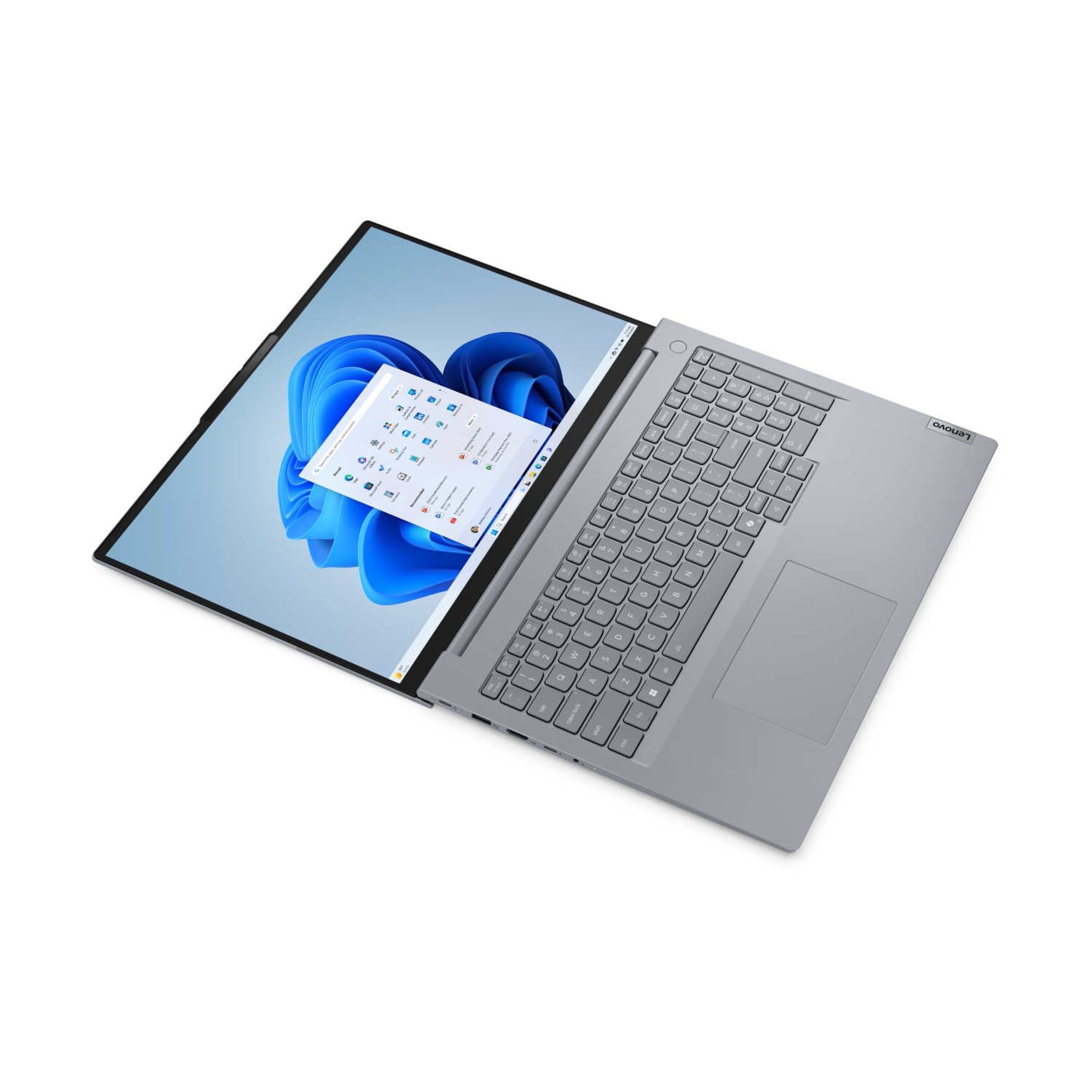Grijze laptop open met Windows 11, schuine weergave op zwarte achtergrond.